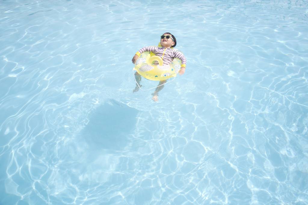 Japanese boy on a floatation ring - pools tokyo