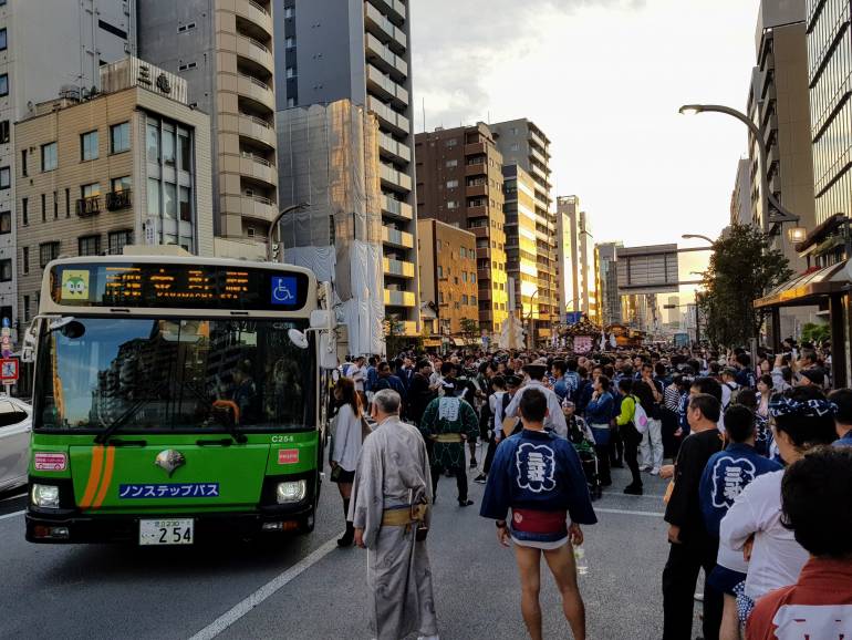 A Toei Bus pulls over during the Sanja Matsuri in Asakusa