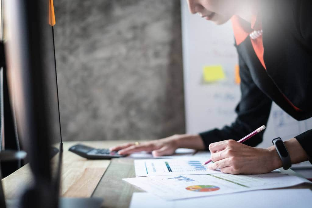 businesswoman doing paperwork for Japan corporate tax