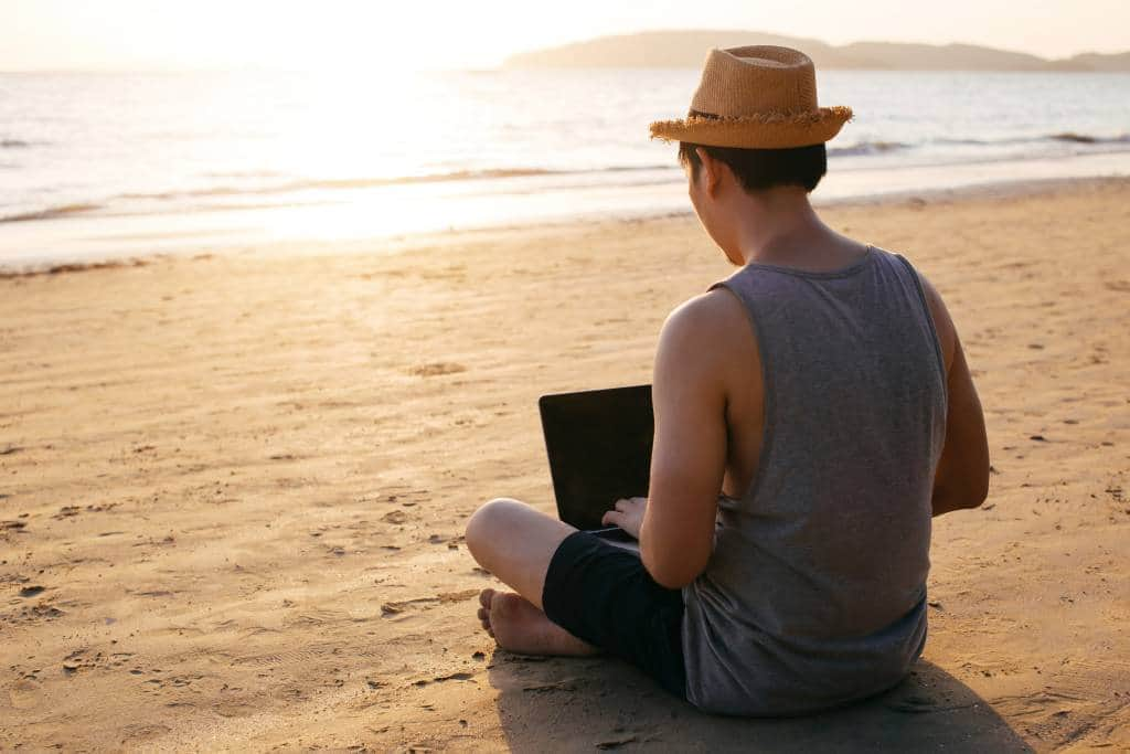 digital nomad on beach