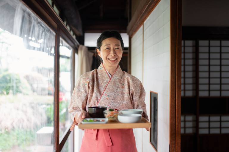 Portrait of a landlady at a traditional Japanese Ryokan (hotel). Tokyo, Japan