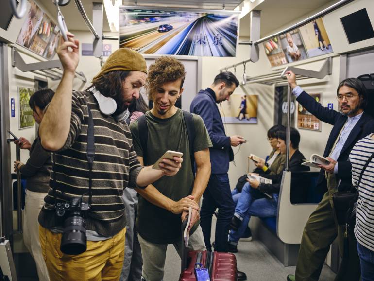 Tourists on a Crowded Japanese Subway Train