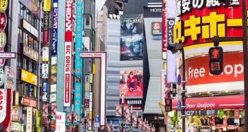 godzilla overlooking the crowds in Shinjuku