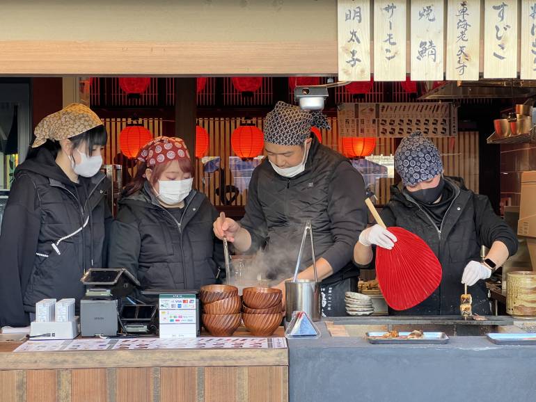 Four staff members at a seafood takeout restaurant at Senkyaku Banrai