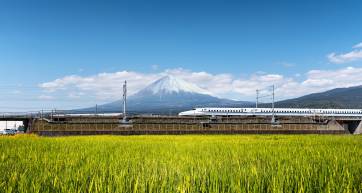 The shinkansen bullet train passing Mt Fuji