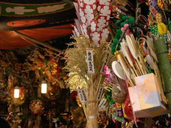 ornamental rakes decorated with lucky charms for sale during the Tori no Ichi (Rooster Market) at Hanazono Shrine in Shinjuku