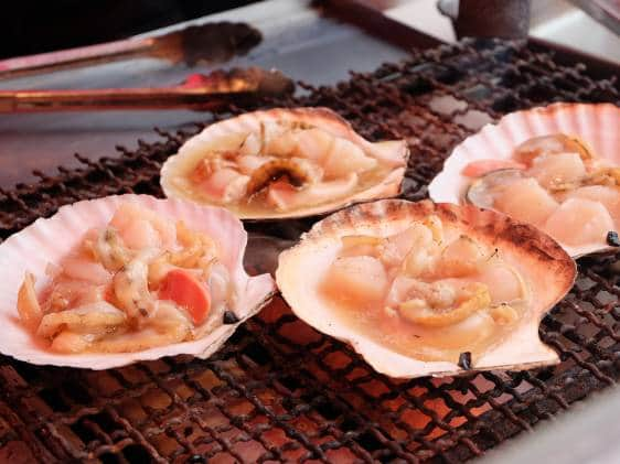 Scallops grilling at Hakodate's morning fish market