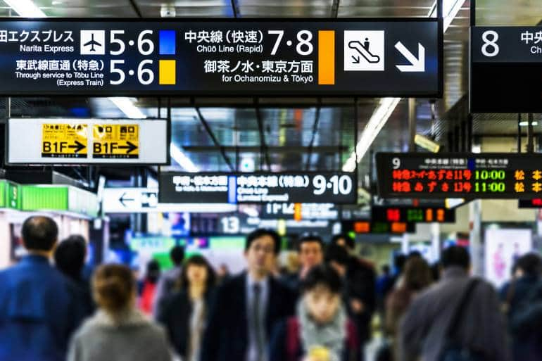 commuters at Shinjuku train station in Tokyo