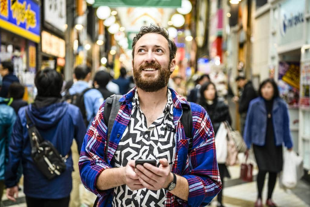 man with japanese cell phone