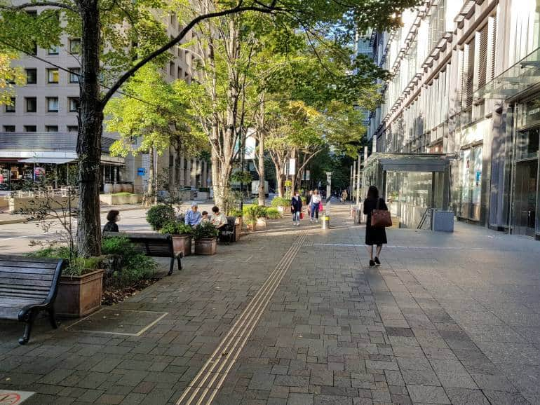 Woman strolling under trees, Naka Dori Marunouchi