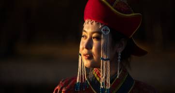 Portrait of a young woman in traditional Mongolian dress.