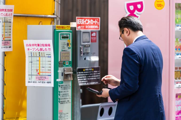 Man paying parking fee