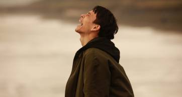 A man yelling at the sea