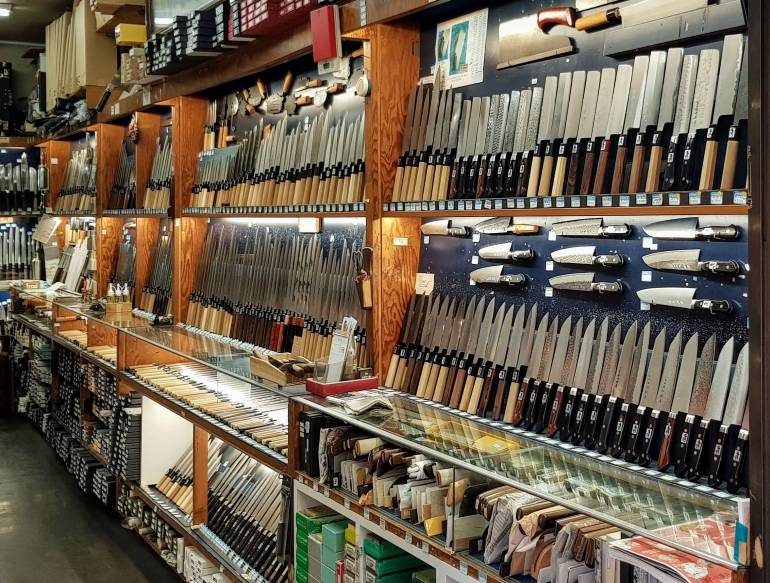 Interior of Tsubaya, knives displayed on wall shelves